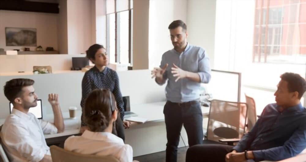 Group discussion with one person presenting to colleagues
